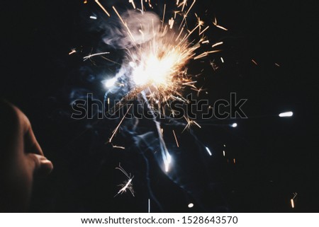 A closeup picture of a lighting sparkler during Diwali