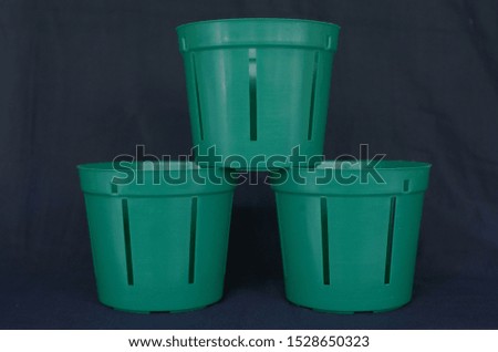 empty flower pot isolated on black background, Green pot