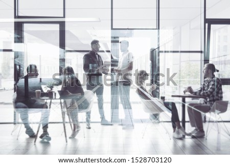 Concept background with business people silhouette working in a modern office. Double exposure Royalty-Free Stock Photo #1528703120