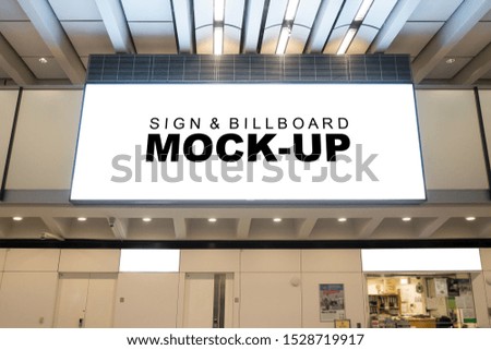 Mock up large horizontal billboard with clipping path, signboard frame hanging from ceiling of hall over entrance, empty space for advertising or public information, advertisement concept
