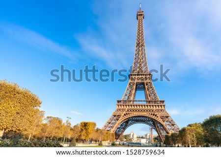 Eiffel Tower on blue sky background in autumn day. Paris Best Destinations. Travel in Europe Concept. Landmark, Sightseeing, Holidays and vacation in France. Panoramic View. 