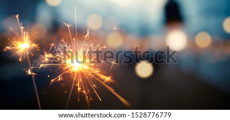 Happy New Year, Burning sparkler with bokeh light background Royalty-Free Stock Photo #1528776779