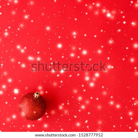 Gift decor, New Years Eve and happy celebration concept - Christmas baubles on red background with snow glitter, luxury winter holiday card