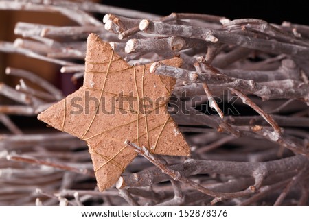 christmas star decoration with wooden branches