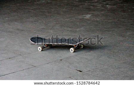 skateboard on concrete background with copy space  - Stock Photo