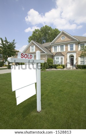 Sold sign at suburban house