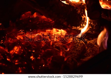 The texture of glowing coals in place of a dying bonfire