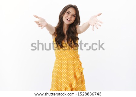 Oh its you. Firendly cheerful hospitable cute woman invite come in, see friend reaching hands forward to welcome and give hug, cuddling, embracing guests, smiling happy, white background Royalty-Free Stock Photo #1528836743
