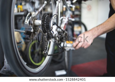Fixing the bicycle problem in workshop, stock photo