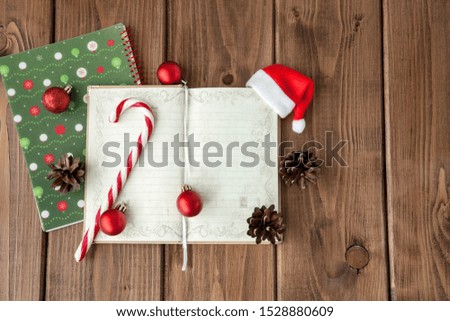 Christmas or New Year planning background on a wooden background. Prepare to winter holidays. Top view, flat lay