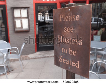 Please see hostess to be seated sign stands in front of restaurant 