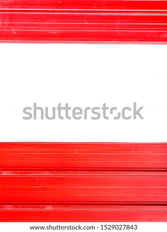 Large red and white horizontal stripes painted on a horizontally ridged background