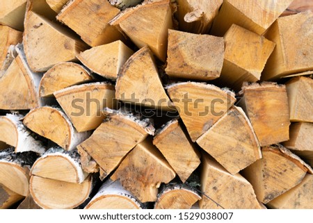 Texture of stacked birch firewood
