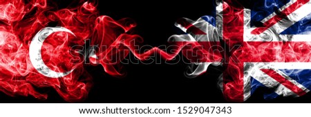 Turkey vs United Kingdom, British smoke flags placed side by side. Thick colored silky smoke flags of Turkish and United Kingdom, British
