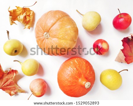 Dry maple leaves, yellow pears, orange pumpkin and red apples flat lay autumn photography. Fall season picture. October harvest