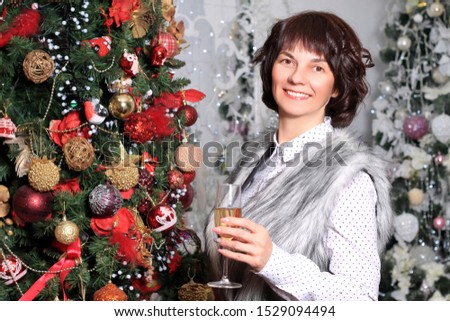 woman smiling near new year tree