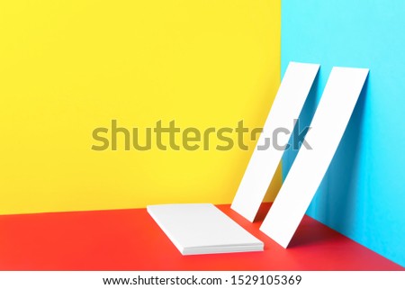 Empty sheets on color background. Mockup for design