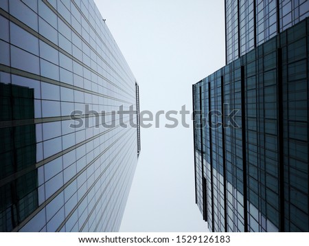 Business Centre skyscraper parallel roofs of skyscrapers on a gray background 