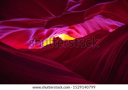 Abstract design of lower antelope canyon, Arizona. If you want to see these colorful patterns, you have to go there in daylight. When the rays of sun reflects on the canyon, you’ll see something like.