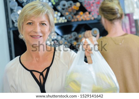 a customer holding a cellophane