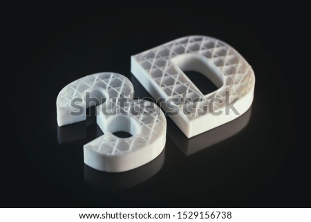 3D printing concept. 3D letters ABS white color against black background, Thermoplastic material from polylactic (pla) acid.