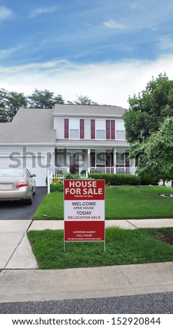 For Sale Open House Welcome Real Estate Sign on curb of Suburban High Ranch Style Home Residential Neighborhood USA