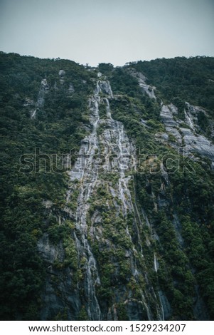 Waterfall At Milford Sound - New Zealand