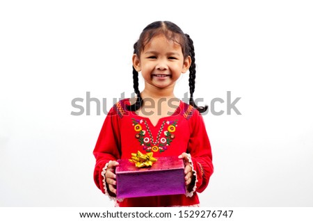 Asian Baby girl holding gift box for christmas and happy new year concept Isolated on white backgrounds 