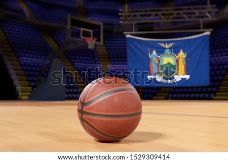 New York state flag and basketball on Court Floor