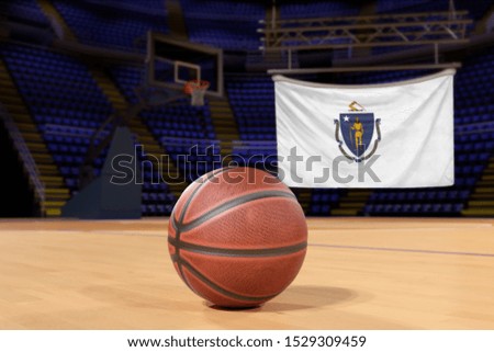 Massachusetts state flag and basketball on Court Floor
