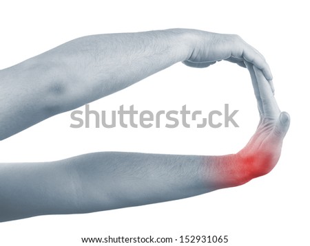Pain in a man wrist. Male holding hand to spot of wrist pain. 