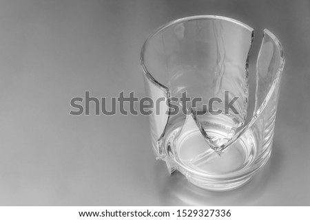 Broken glass dish on white background. Part of home decoration that was damaged during washing. Royalty-Free Stock Photo #1529327336