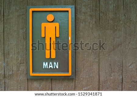Restroom sign on a toilet door,on wood background.Toilet sign  / Toilet icons set. Men WC signs for restroom.