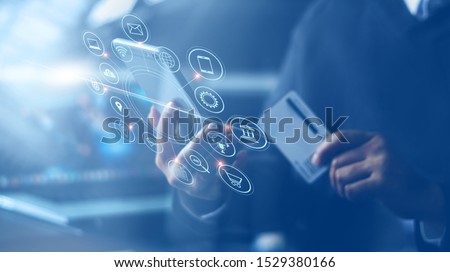 Businessman with mobile smartphone and credit card in hand paying online and shopping on virtual interface global network, online banking and digital marketing. Royalty-Free Stock Photo #1529380166