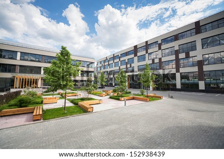 Park with trees and fountains in front of the Business Center Royalty-Free Stock Photo #152938439