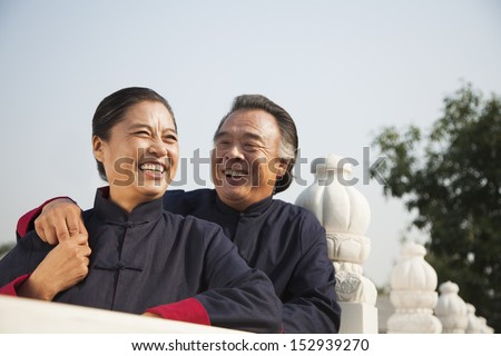 Senior couple dressed in traditional Chinese clothing, portrait