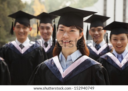 Young Graduates in Cap and Gown