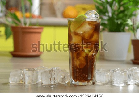 homemade cocktail on the wooden table closeup on kitchen blurred background