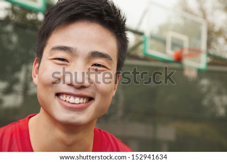 Young man on the basketball court, portrait