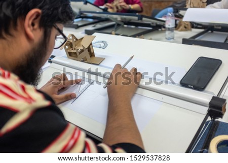 University or College Student Studying and Working in an Open Plan Classroom Work Space. - Image Royalty-Free Stock Photo #1529537828