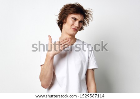handsome man with tousled hair white t-shirt