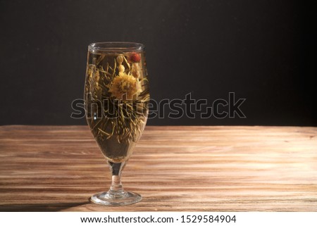 Chinese tea brewed in a glass wine glass