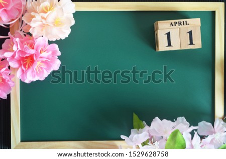 Number cube of Date, Background design with sakura flower on the green board, April 11.