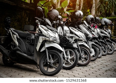 Motorcycles group parking on city street during adventure journey. Motorcyclists community travel concept. Royalty-Free Stock Photo #1529631368