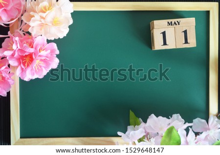 Number cube of Date, Background design with sakura flower on the green board, May 11.