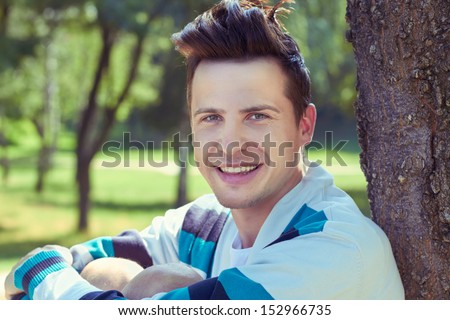  portrait of an attractive young man in the park