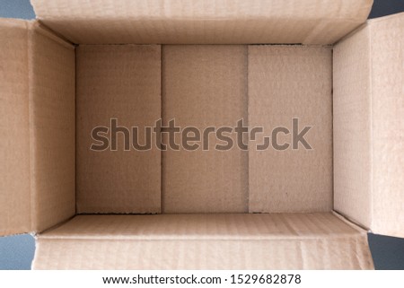 Empty open cardboard box, inside view. Close up