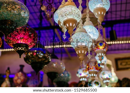 blue, yellow, red lamps and chandeliers in the evening Turkish market at night in the city of Alanya