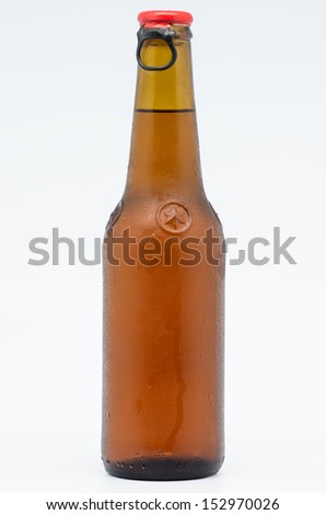 macro photograph of a bottle of beer toast on white background
