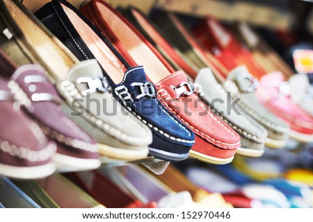Row of slip-on shoes in a footwear shop Royalty-Free Stock Photo #152970446